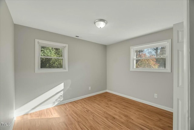 unfurnished room featuring light hardwood / wood-style flooring