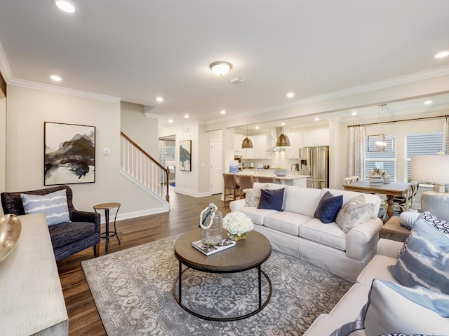 living room featuring dark hardwood / wood-style floors and ornamental molding