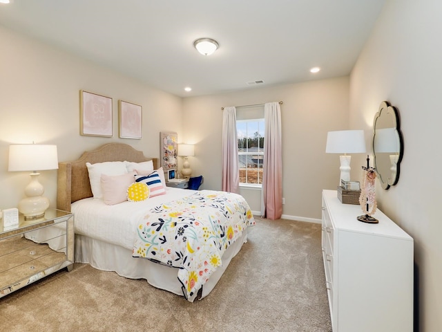 bedroom with light colored carpet