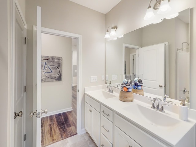 bathroom featuring hardwood / wood-style floors and vanity