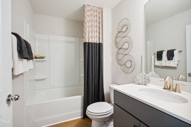 full bathroom featuring vanity, wood-type flooring, shower / tub combo, and toilet