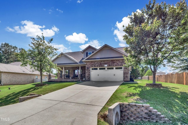 craftsman-style home featuring a front yard and a garage