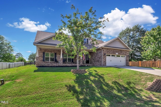 craftsman inspired home with a garage and a front yard