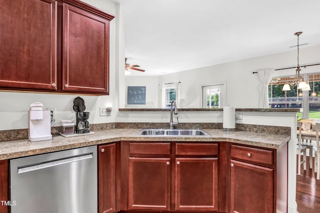 kitchen with decorative light fixtures, sink, kitchen peninsula, ceiling fan, and stainless steel dishwasher