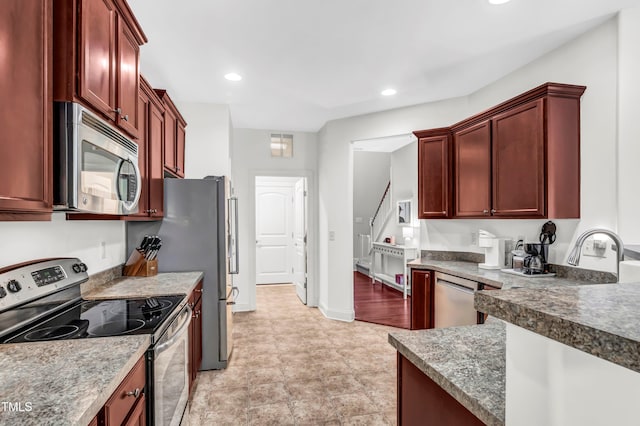 kitchen featuring stone counters and stainless steel appliances