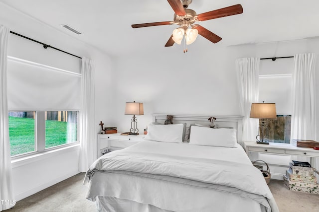 bedroom with ceiling fan and carpet