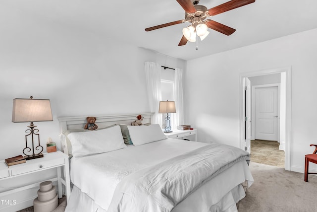 bedroom with ceiling fan and light colored carpet