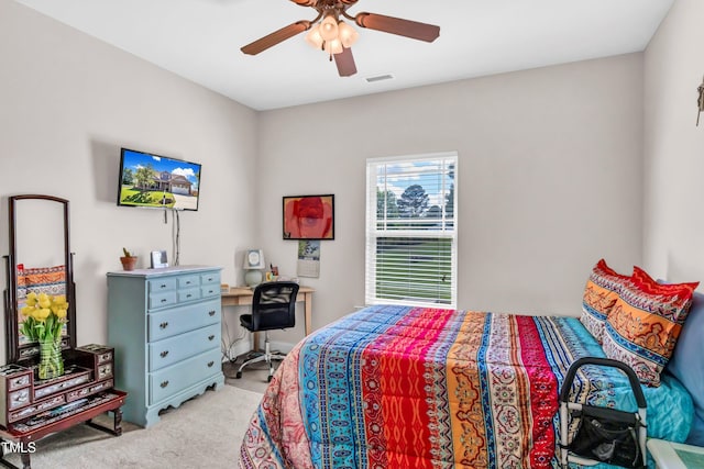 bedroom with light carpet and ceiling fan