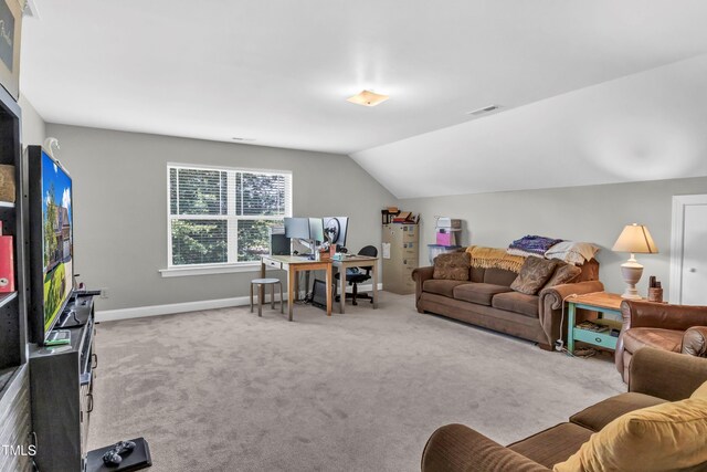 living room with vaulted ceiling and carpet