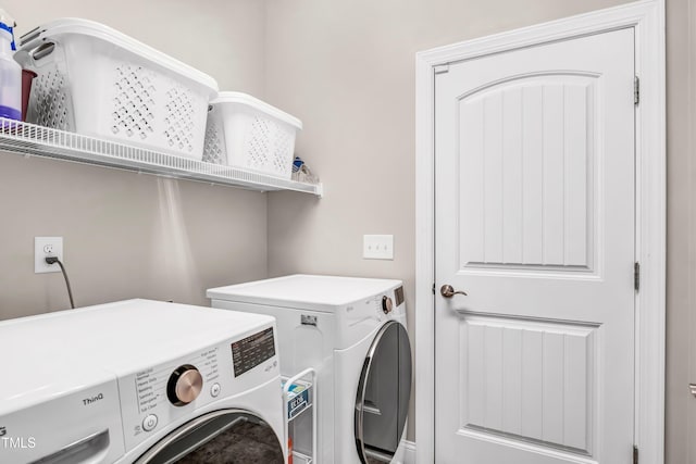 laundry room featuring separate washer and dryer