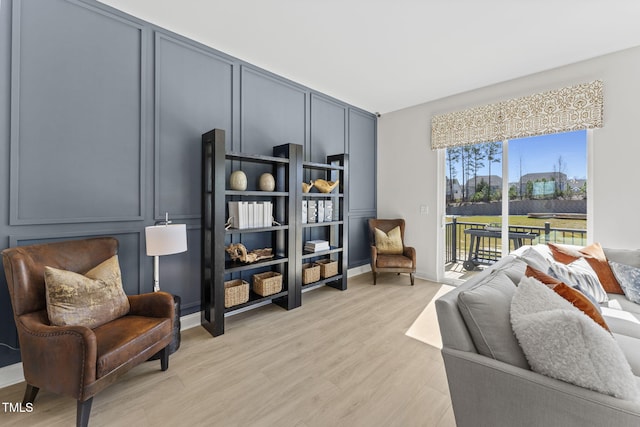 sitting room featuring light wood-type flooring