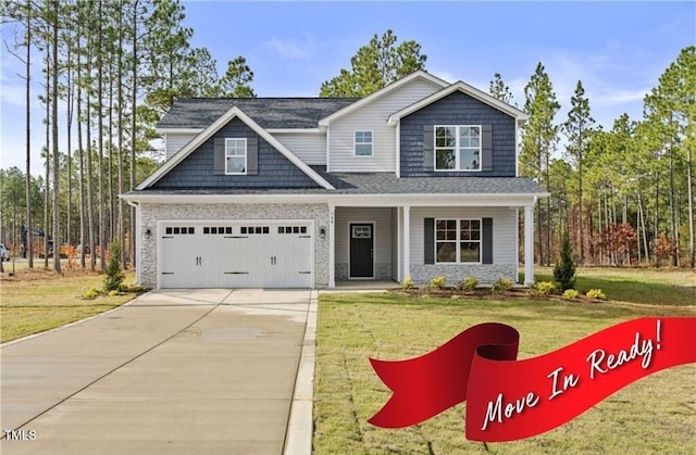 craftsman-style home with a front yard and a garage