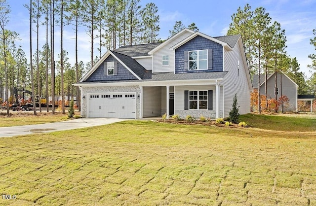 craftsman inspired home with a front yard and a garage