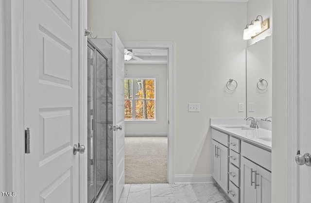 bathroom featuring ceiling fan, vanity, and walk in shower