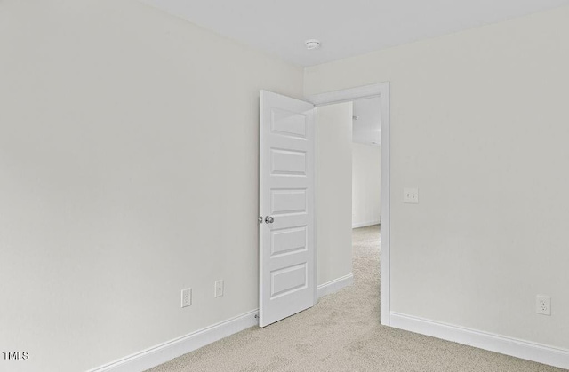 empty room with light colored carpet