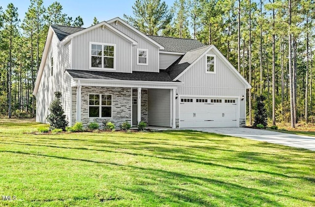 view of front of property featuring a garage and a front lawn