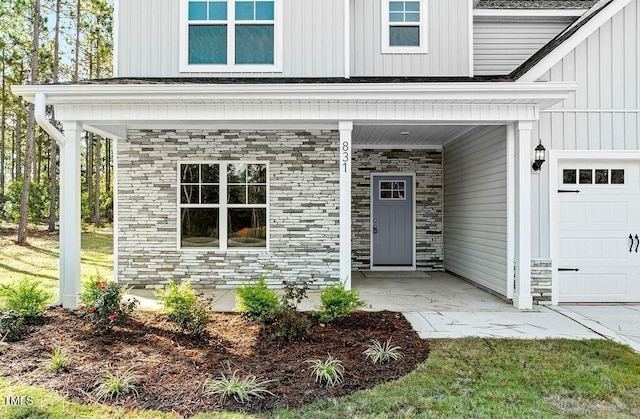 view of exterior entry with covered porch