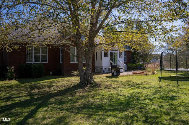 view of yard with a trampoline