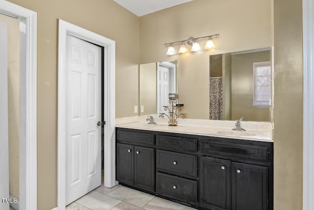 bathroom with tile patterned floors and vanity