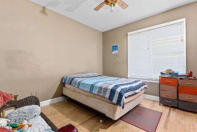 bedroom featuring ceiling fan and light hardwood / wood-style flooring