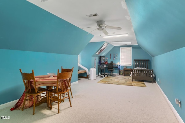 carpeted bedroom with lofted ceiling