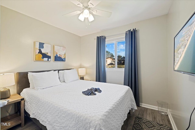 bedroom featuring ceiling fan and dark hardwood / wood-style flooring