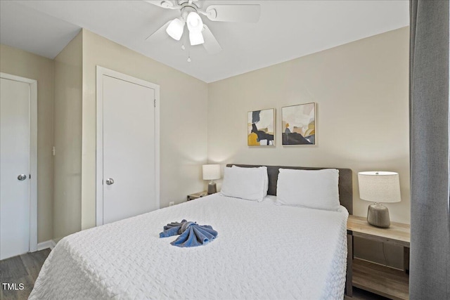 bedroom featuring ceiling fan and hardwood / wood-style flooring