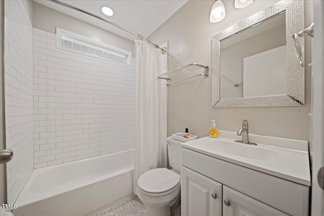 full bathroom featuring vanity, toilet, and shower / bath combo with shower curtain