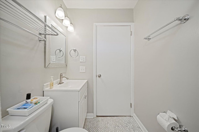 bathroom with tile patterned floors, vanity, and toilet