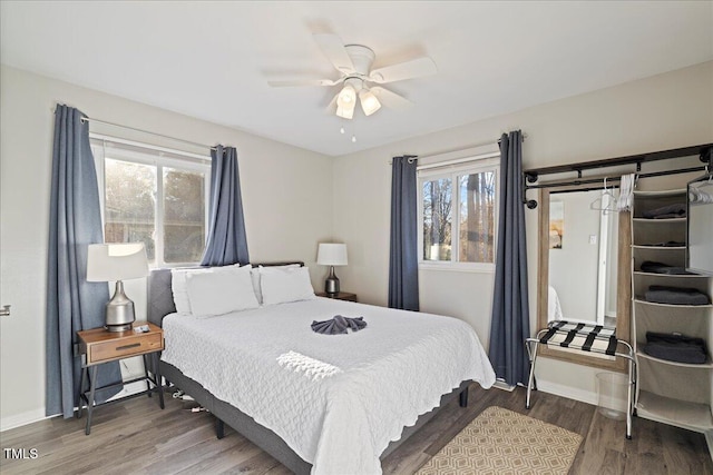 bedroom with hardwood / wood-style flooring and ceiling fan