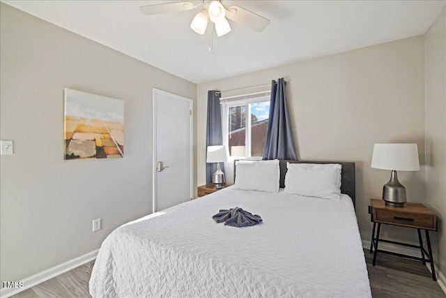 bedroom with ceiling fan and hardwood / wood-style floors