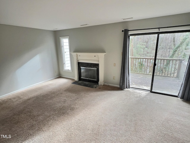 unfurnished living room featuring carpet floors