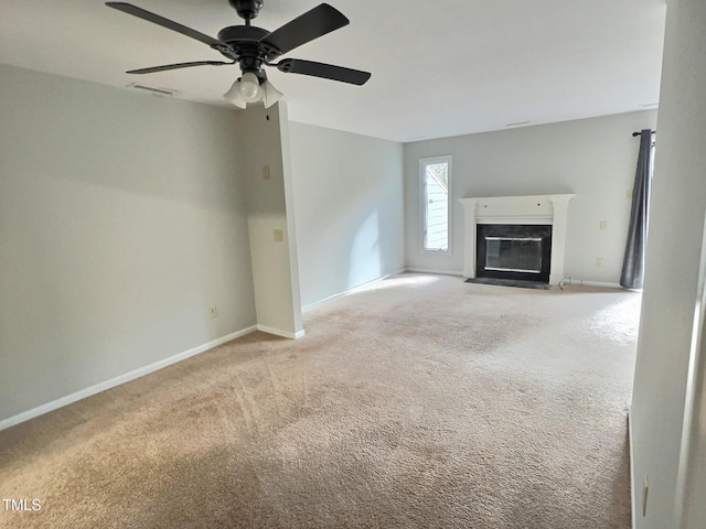 unfurnished living room with light carpet and ceiling fan