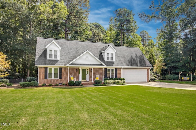 cape cod-style house featuring a front yard and a garage