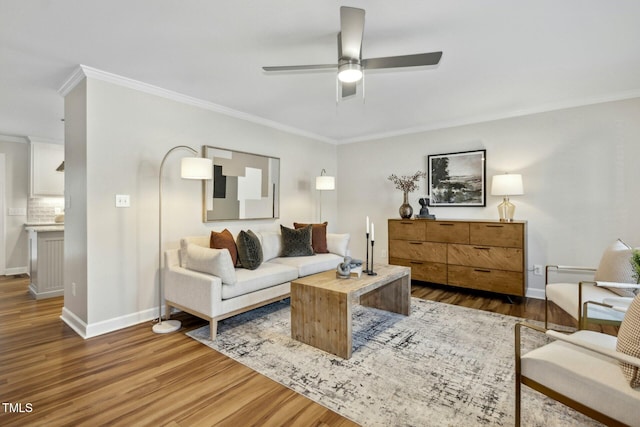 living room featuring ornamental molding, ceiling fan, and hardwood / wood-style floors