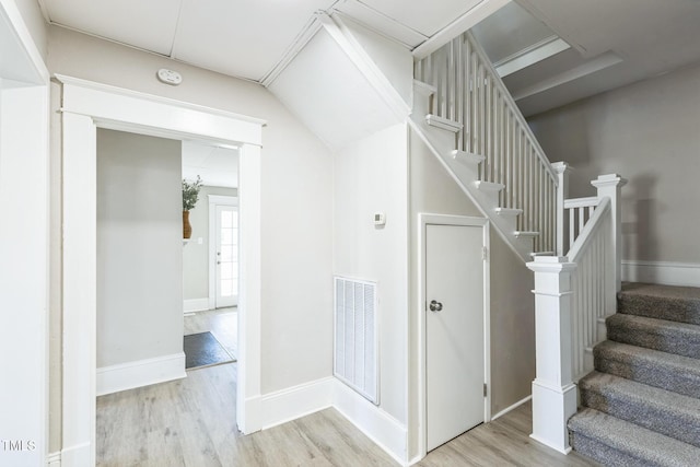 stairway with wood-type flooring