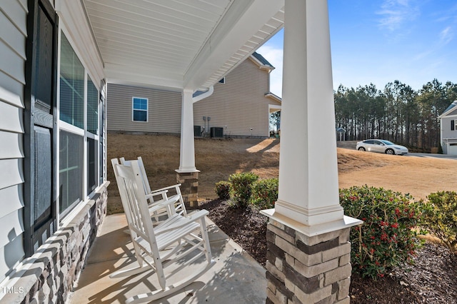 view of patio / terrace featuring cooling unit and a porch