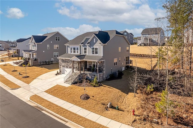 view of front facade featuring a garage and a front lawn