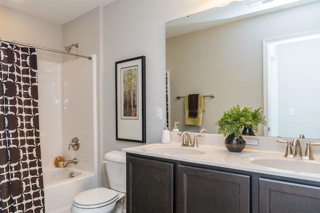 full bathroom with vanity, toilet, and shower / tub combo with curtain