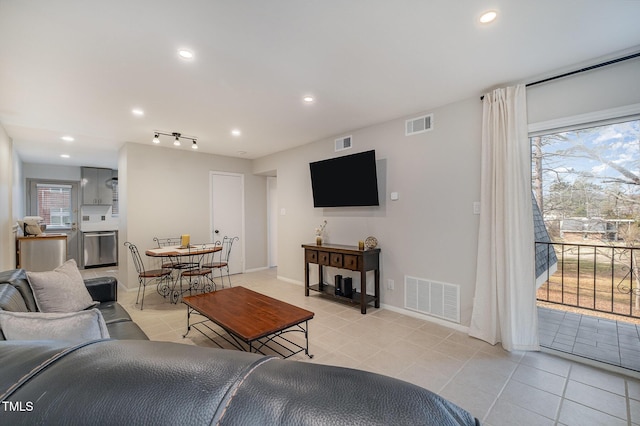 living room with light tile patterned floors