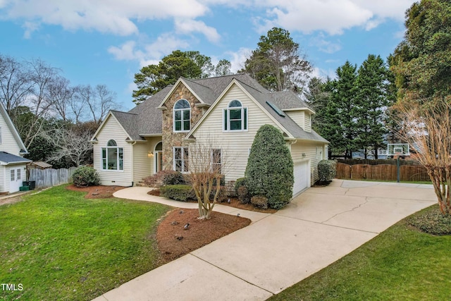 view of property featuring a garage and a front yard