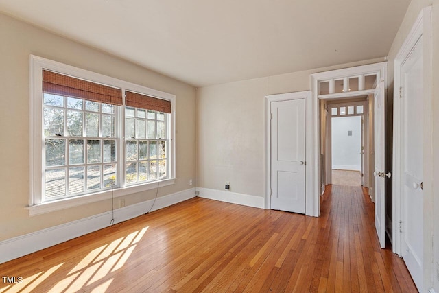 unfurnished room with hardwood / wood-style floors