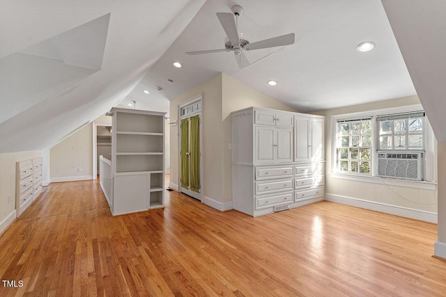 bonus room featuring lofted ceiling, cooling unit, ceiling fan, and light wood-type flooring