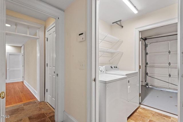 clothes washing area featuring independent washer and dryer