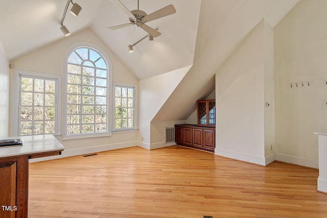 bonus room with lofted ceiling, light hardwood / wood-style flooring, and ceiling fan