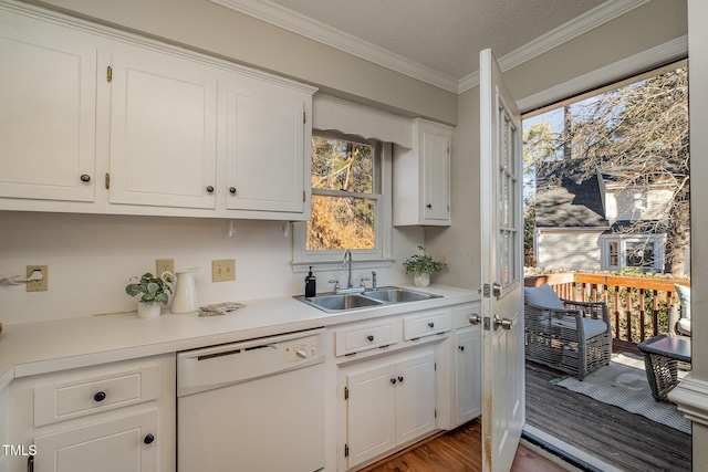 kitchen featuring sink, white cabinetry, a healthy amount of sunlight, and dishwasher