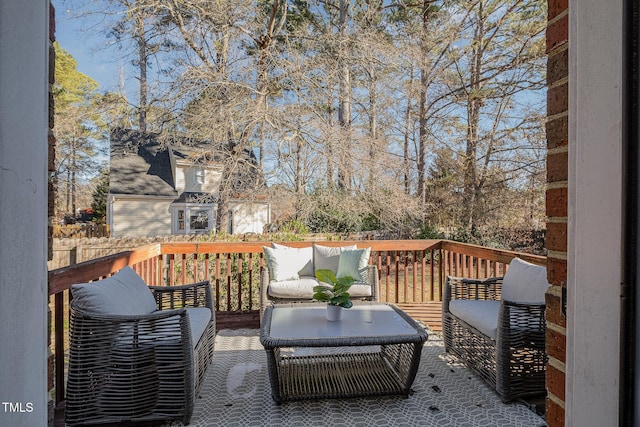 wooden terrace featuring an outdoor living space