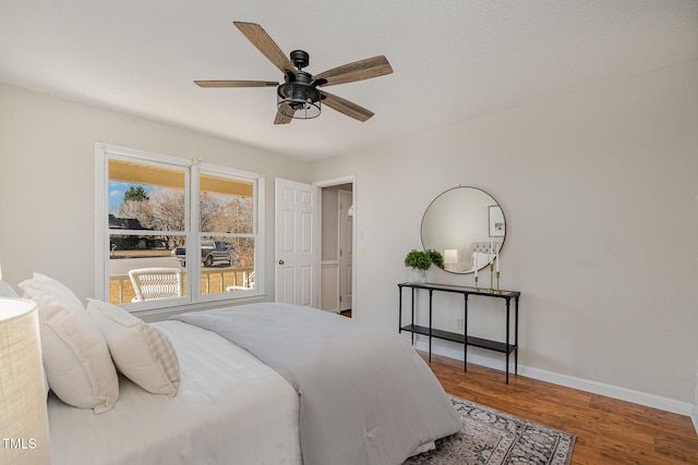 bedroom featuring ceiling fan and hardwood / wood-style floors