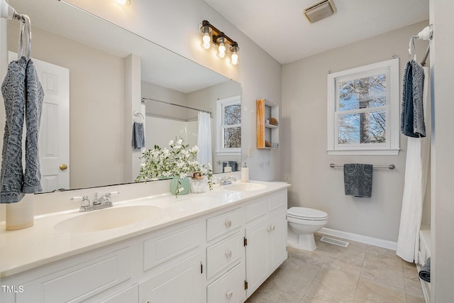 full bathroom featuring toilet, shower / bathtub combination with curtain, tile patterned floors, and vanity