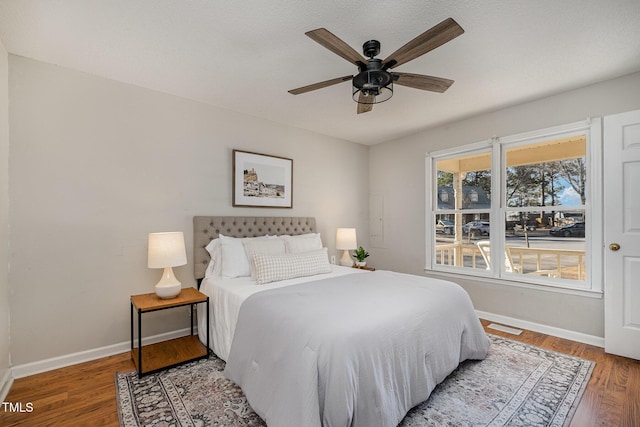 bedroom featuring wood-type flooring and ceiling fan